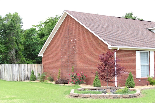 view of property exterior with a lawn