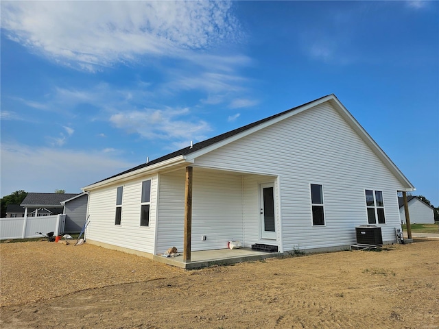 back of property featuring a patio area and cooling unit