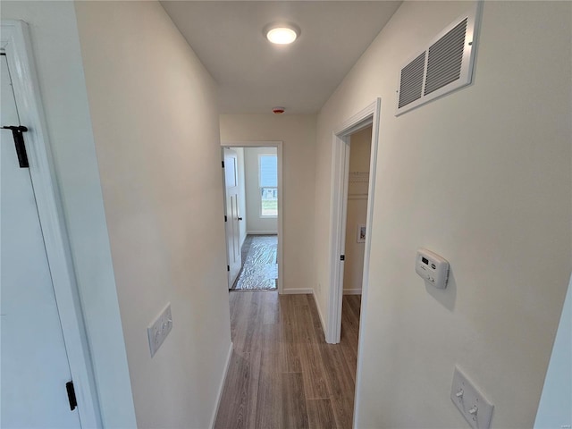 hall with light hardwood / wood-style floors