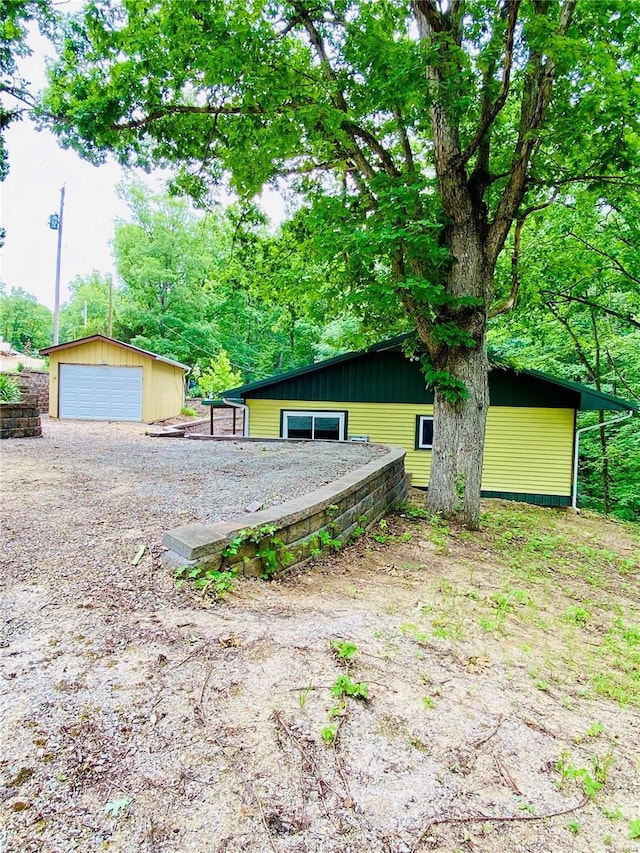 exterior space with an outdoor structure and a garage