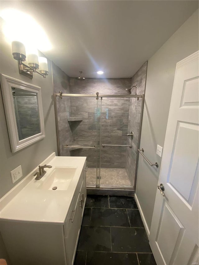 bathroom with vanity and walk in shower