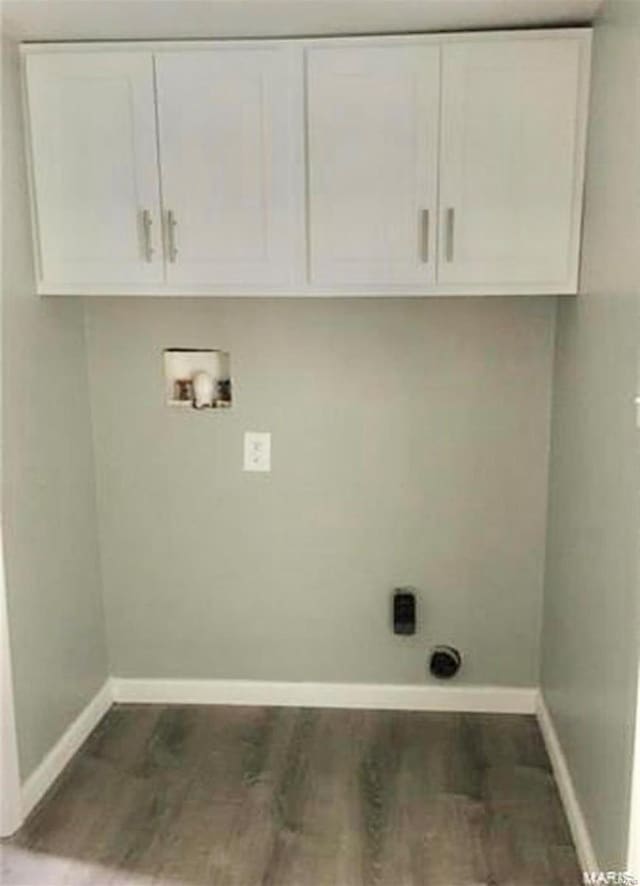 laundry area featuring cabinets, washer hookup, dark hardwood / wood-style flooring, and electric dryer hookup