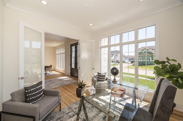 interior space with crown molding and hardwood / wood-style flooring