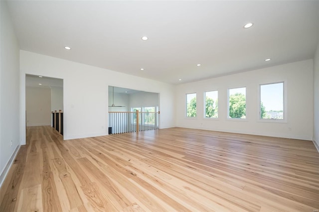 unfurnished living room with light hardwood / wood-style flooring