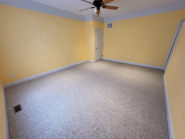 carpeted empty room with ceiling fan and crown molding