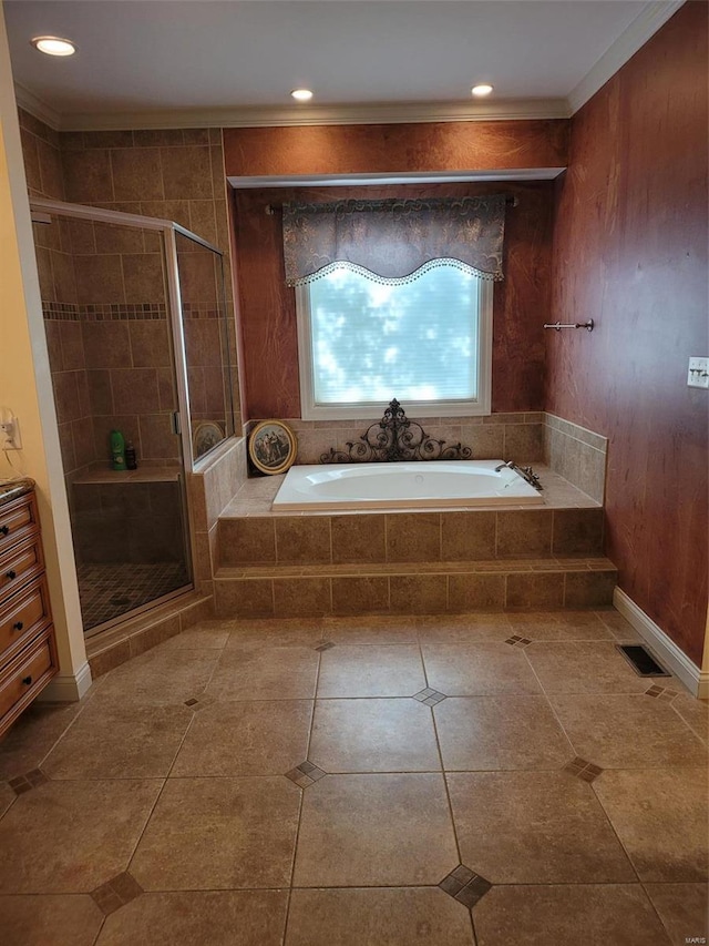 bathroom featuring tile flooring, ornamental molding, and plus walk in shower