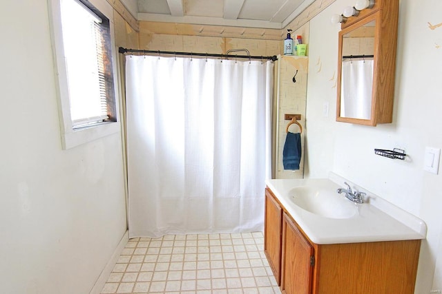 bathroom featuring tile floors and vanity