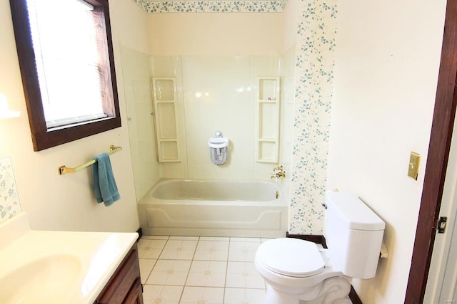 full bathroom featuring tile floors, tub / shower combination, toilet, and vanity