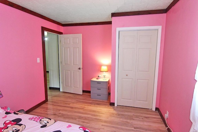 unfurnished bedroom with a closet and wood-type flooring