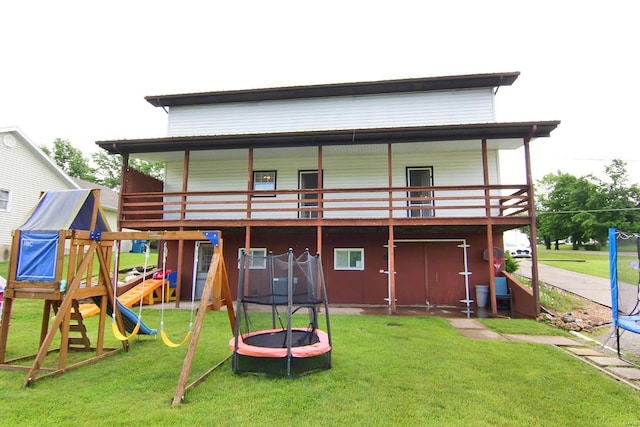 exterior space with a playground and a lawn