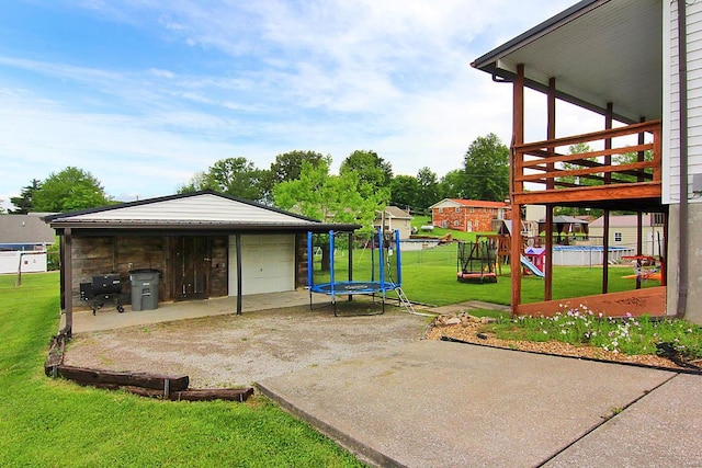 view of patio featuring a playground and a trampoline