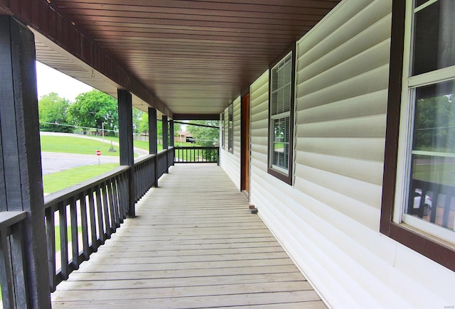 wooden deck with a yard