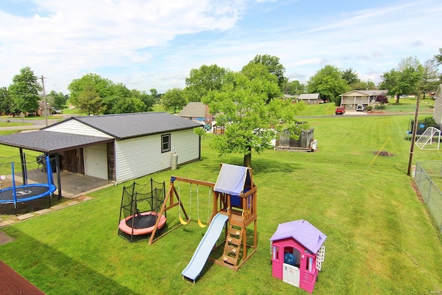 view of play area with a trampoline and a yard