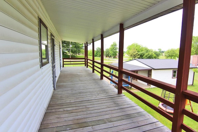 wooden terrace featuring a porch