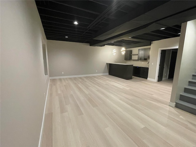 basement featuring light hardwood / wood-style flooring