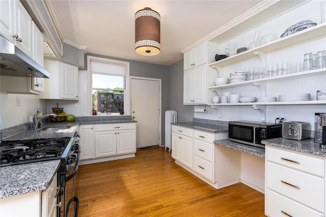 kitchen featuring radiator, light hardwood / wood-style floors, white cabinets, and black range with gas cooktop