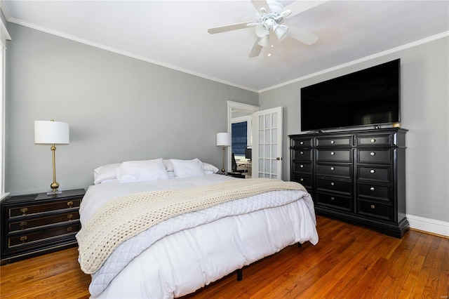 bedroom with ceiling fan, dark wood-type flooring, and crown molding