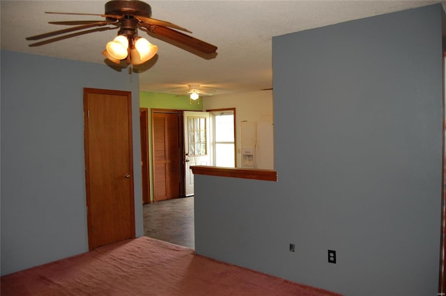 unfurnished room featuring carpet flooring and ceiling fan