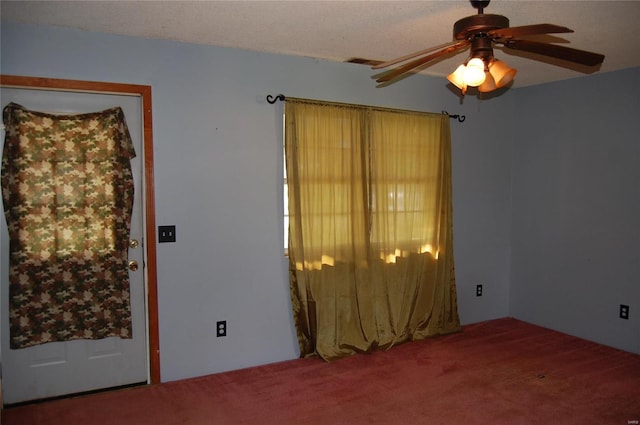 empty room with carpet floors and ceiling fan