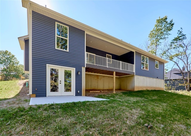 back of house with french doors, a yard, and a patio area