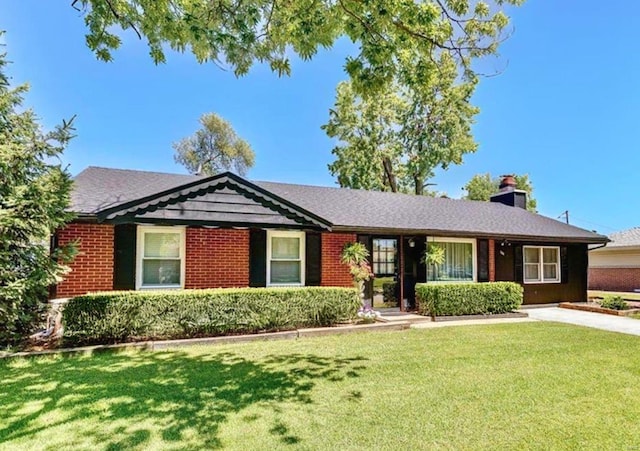 ranch-style home with a front lawn