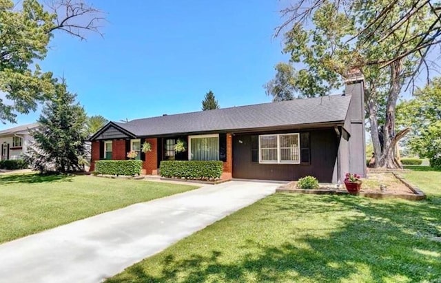 ranch-style home featuring a front yard