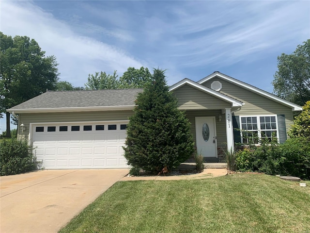 single story home featuring a garage and a front yard