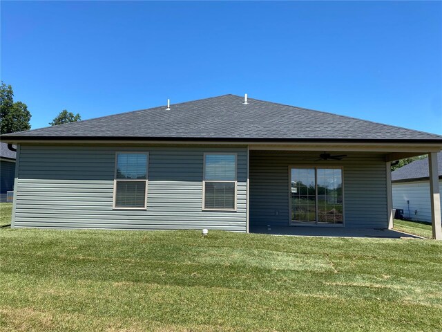 back of house with a lawn, ceiling fan, and a patio