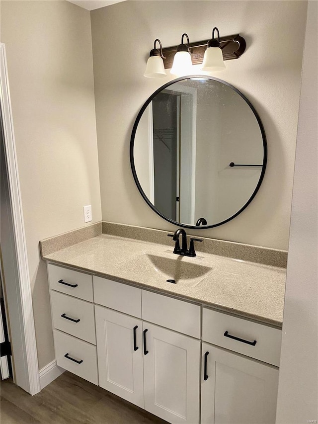 bathroom featuring vanity and hardwood / wood-style floors