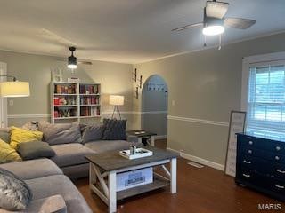 living room featuring ceiling fan and dark hardwood / wood-style flooring