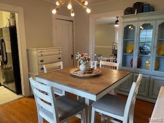 dining room featuring a notable chandelier and wood-type flooring