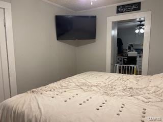 bedroom featuring crown molding