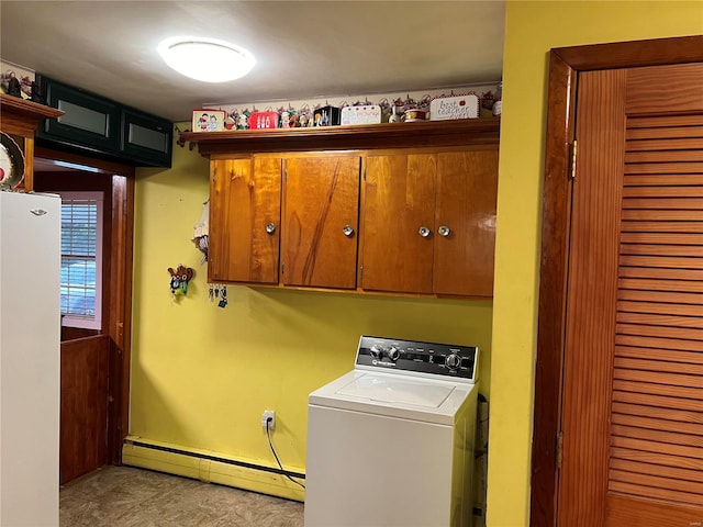 washroom featuring cabinets, washer / clothes dryer, and a baseboard heating unit