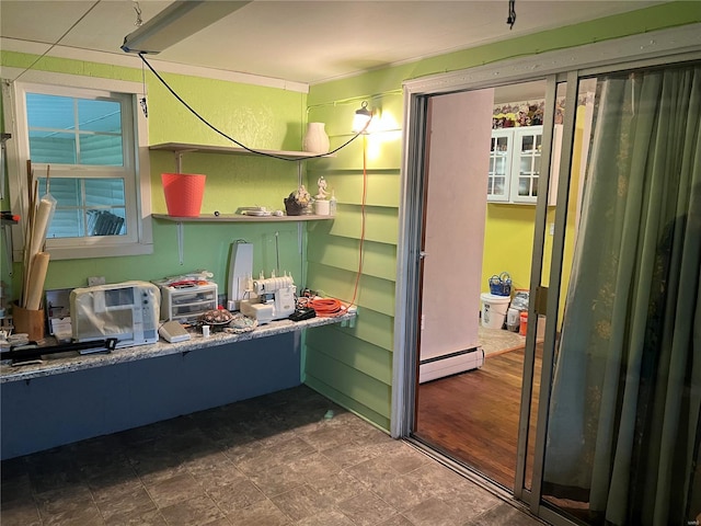 interior space featuring hardwood / wood-style floors and baseboard heating