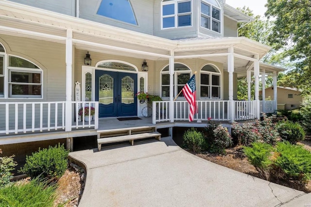 entrance to property featuring a porch