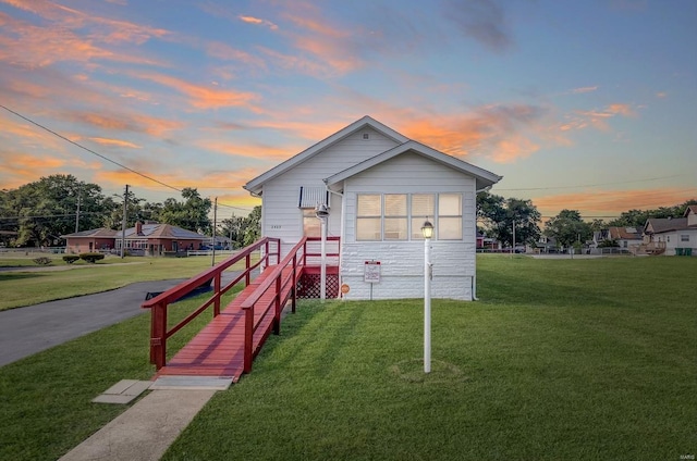 outdoor structure at dusk with a yard