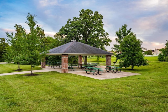 view of property's community with a lawn and a gazebo