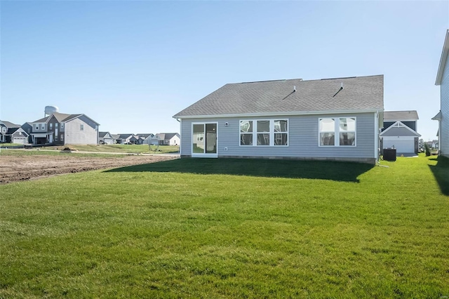 back of house featuring a yard