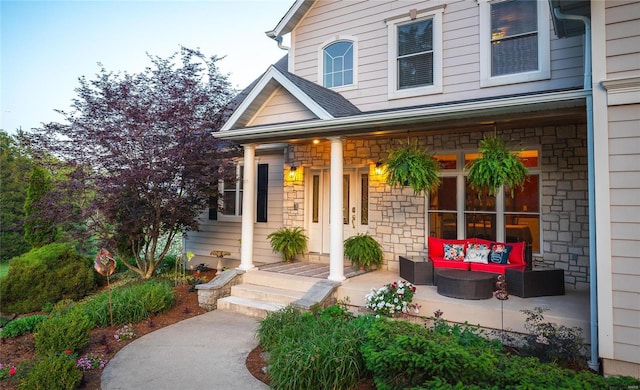 view of exterior entry featuring an outdoor hangout area