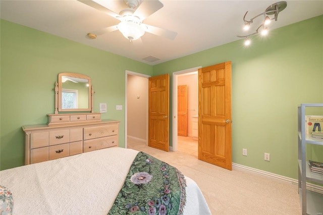 bedroom featuring light colored carpet and ceiling fan