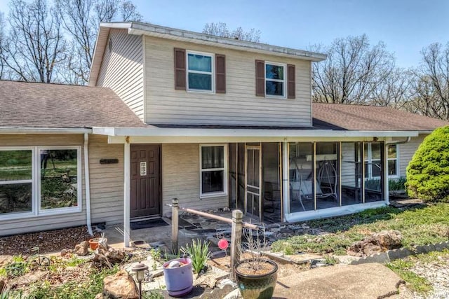 view of front of property featuring a sunroom