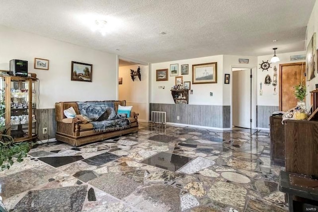 living room featuring a textured ceiling