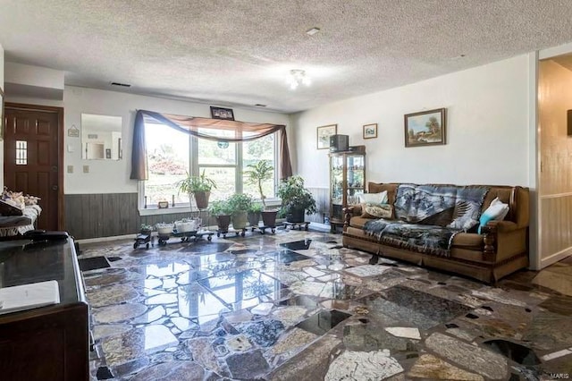 living room featuring a textured ceiling