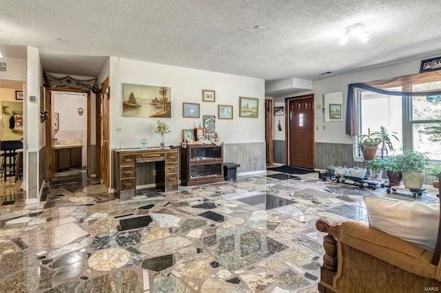 living room with a textured ceiling