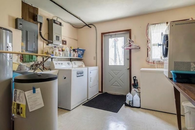 laundry room featuring light tile flooring, washer and clothes dryer, electric water heater, and water heater