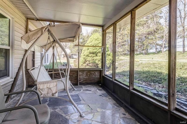 unfurnished sunroom with a healthy amount of sunlight