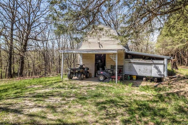 rear view of property featuring a lawn