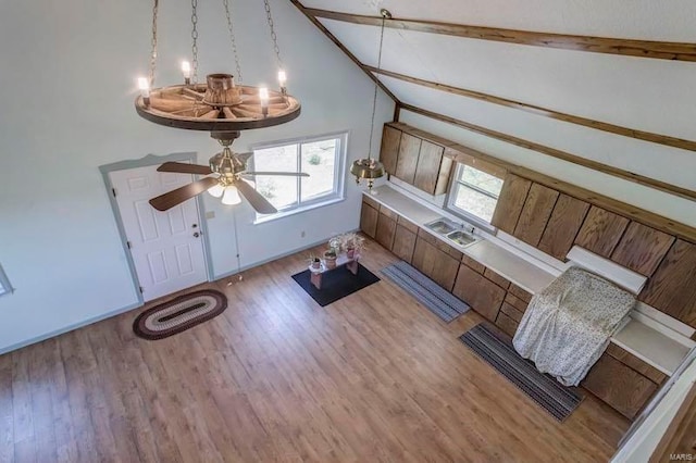 entrance foyer with high vaulted ceiling, wood-type flooring, and ceiling fan