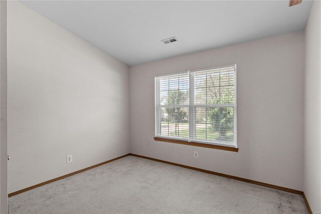 spare room with light colored carpet