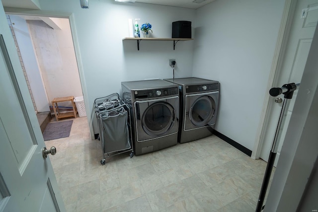 laundry area featuring washing machine and dryer